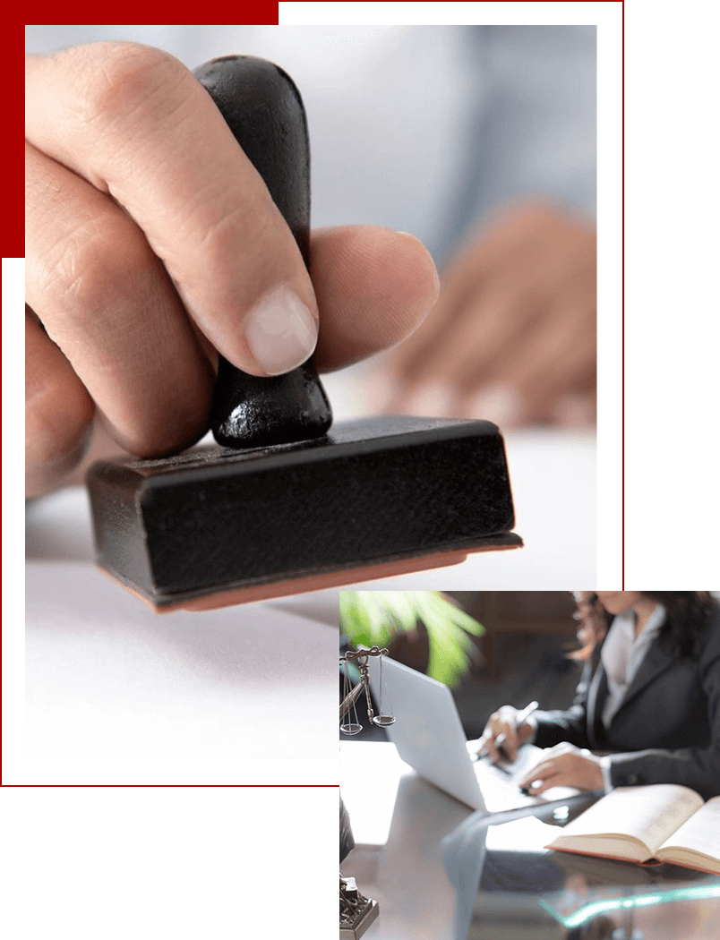 A person is using a rubber stamp on a table.