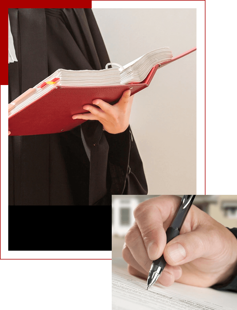 A person holding a book and writing on a pen