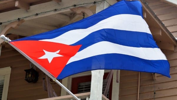 A flag of cuba is flying in the wind.